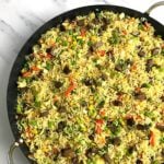 Top view of a Nigerian fried rice recipe dotted with chops of fried liver